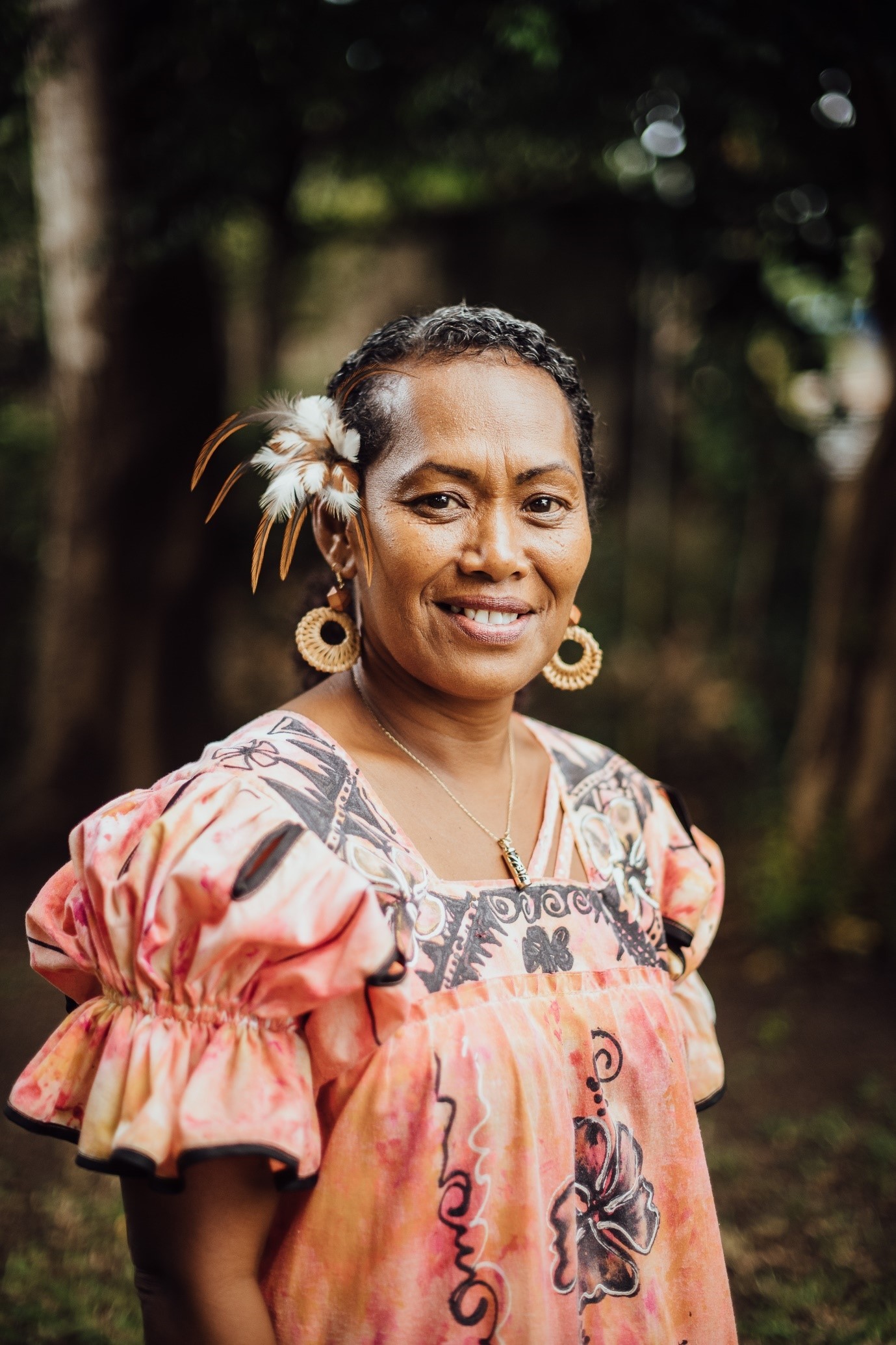 Using a manual sewing machine, Feby makes traditional colorful dresses that are popular among inhabitants of Vanuatu island, and a key part of the local fashion economy.