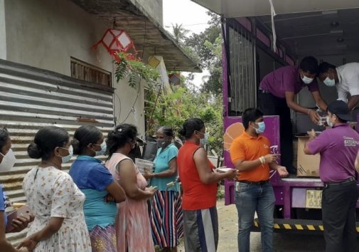 Union Assurance Staff distributing food parcels. Photo Credit: Union Assurance