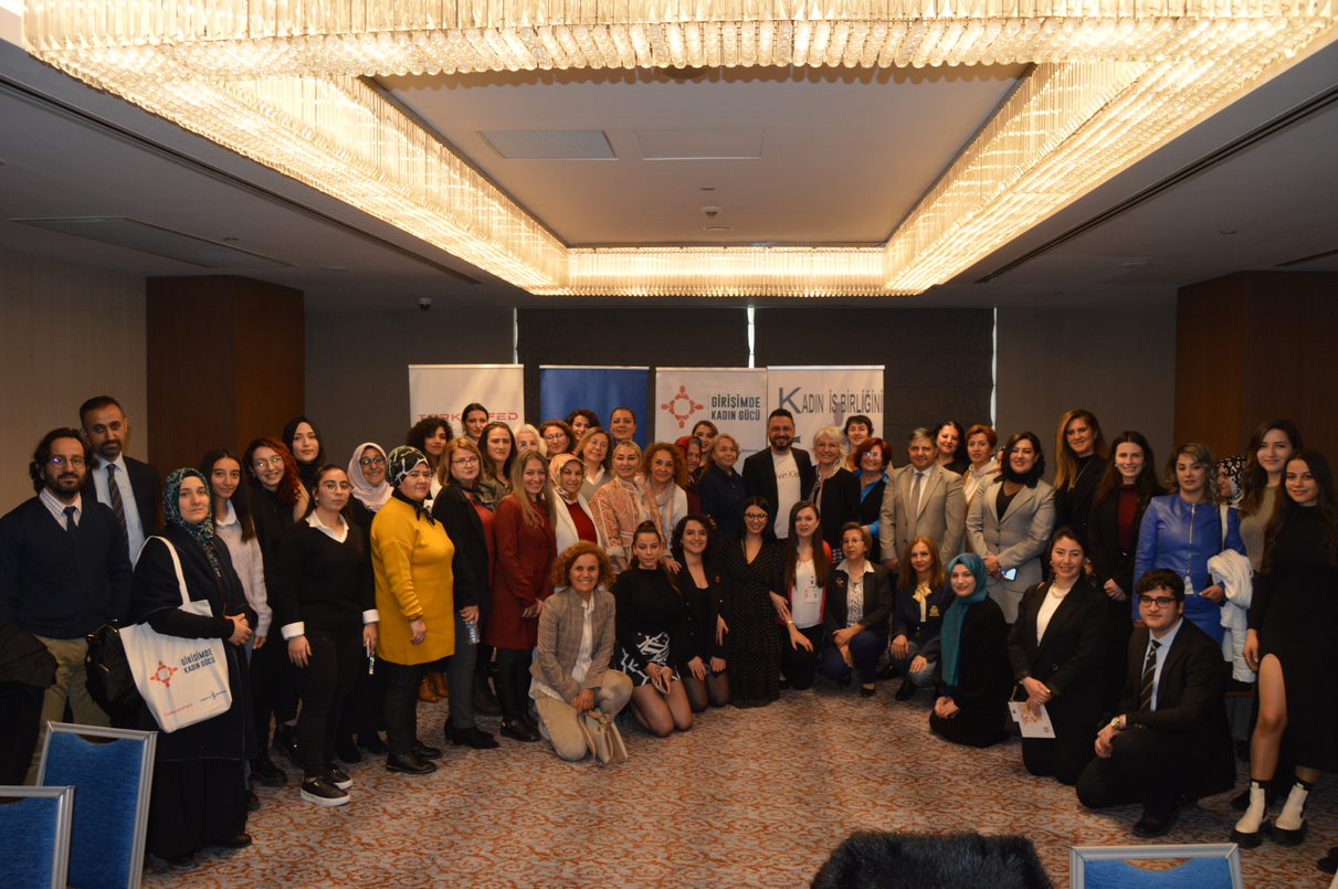 A group of mostly women and some men pose for a photo after a training under the umbrella of the initiative "Leading Women Entrepreneurship for Accelerating Development" run by TURKONFED. Kayseri, Turkiye. Photo credit: TURKONFED