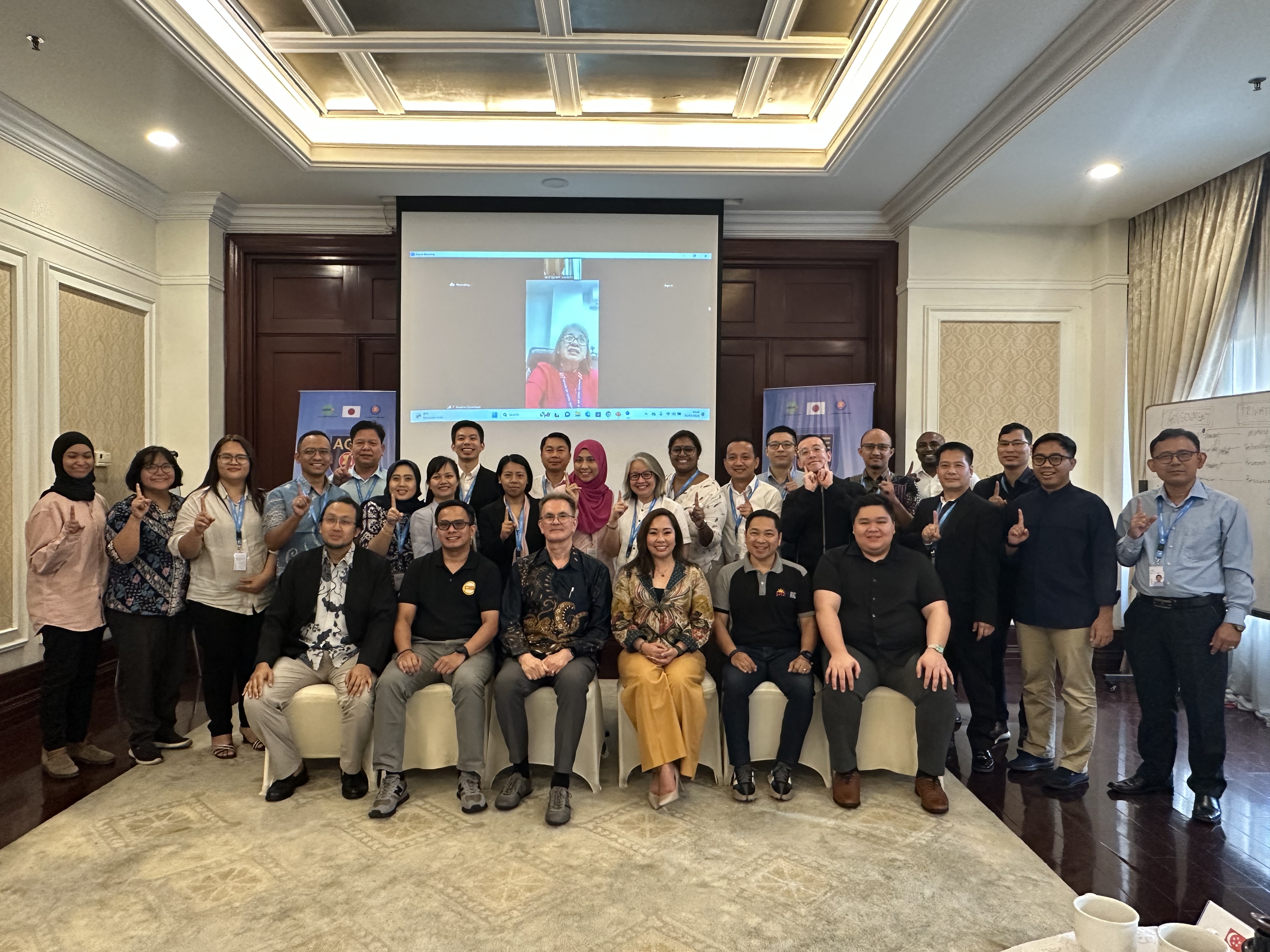 The organizers and participants of the PPP for DM course at the end of the workshop doing the "One ASEAN, One Response" pose.